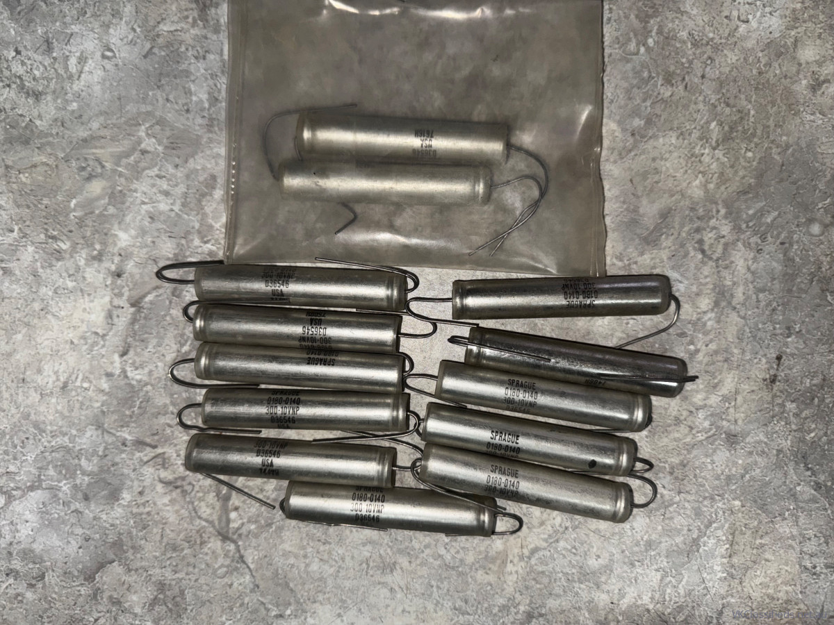13x Sprague 300uF 10V non polarised capacitors